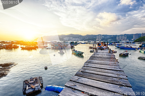 Image of Boat pier at sunset. Beautiful landscape. 