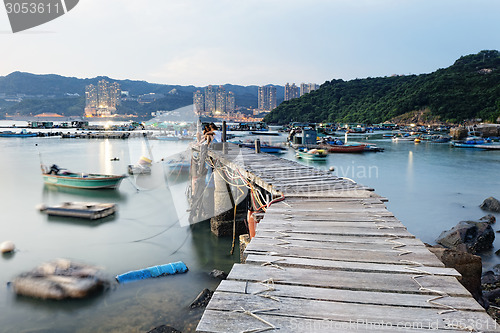 Image of Boat pier at sunset. Beautiful landscape. 