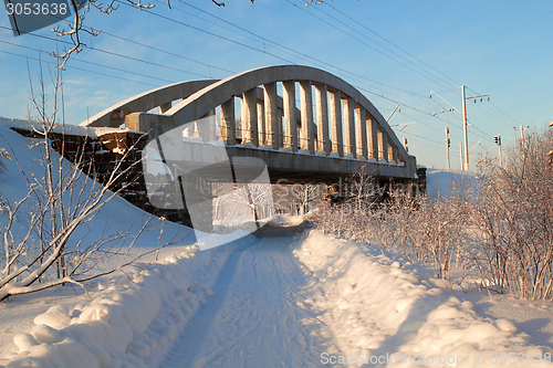 Image of The railway bridge over winter road