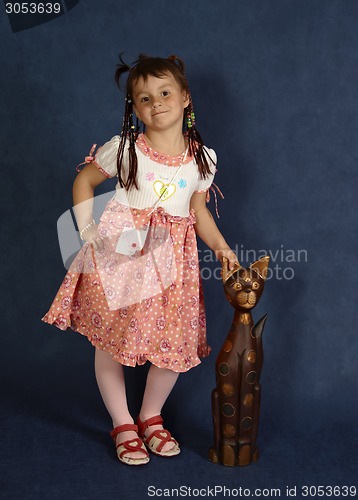 Image of portrait of cute little girl on blue background