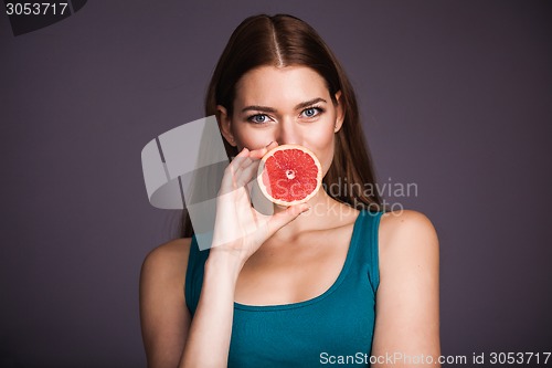 Image of Woman with grapefruit