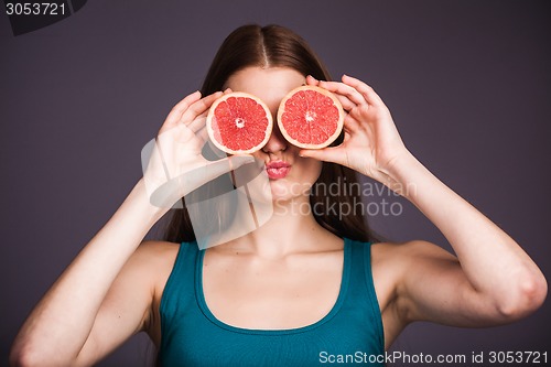 Image of Woman with grapefruit