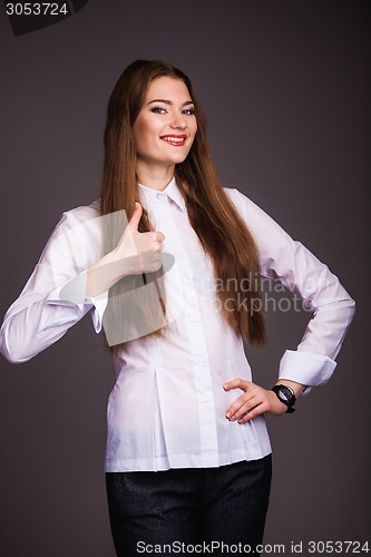 Image of Woman shows thumb up