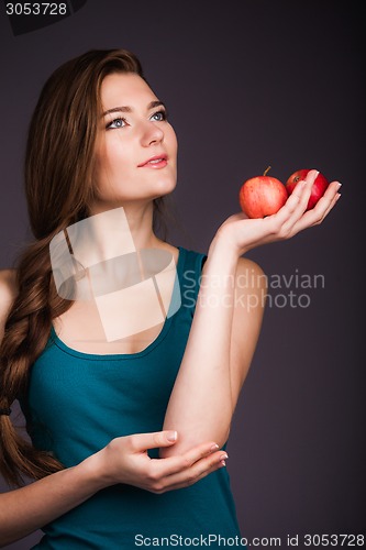 Image of Woman holding apple