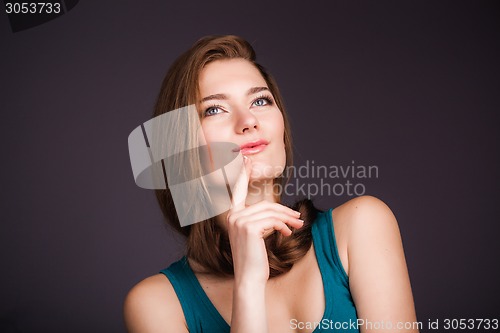 Image of Young woman thinking