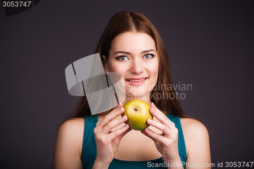 Image of Woman holding apple