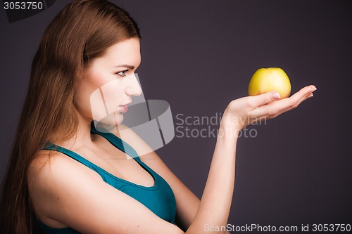 Image of Woman holding apple