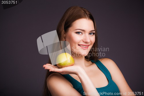 Image of Woman holding apple