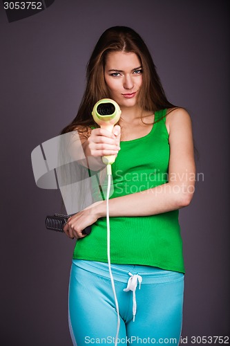 Image of Woman with hair dryer