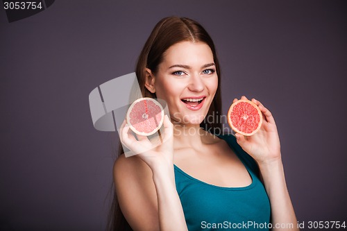 Image of Woman with grapefruit
