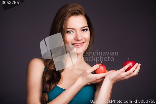 Image of Woman holding apples