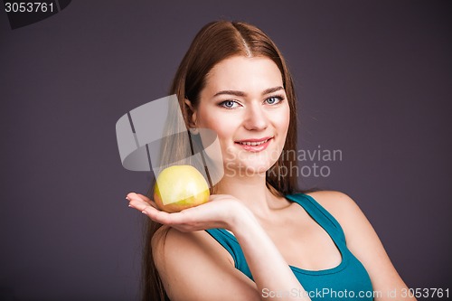 Image of Woman holding apple