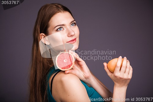 Image of Woman with grapefruit