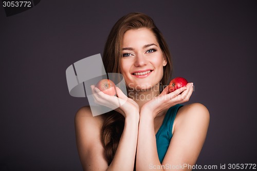 Image of Woman holding apples