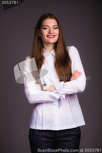 Image of Smiling woman with crossed arms