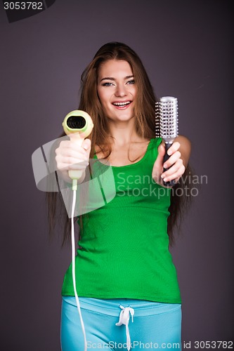 Image of Woman with hair dryer