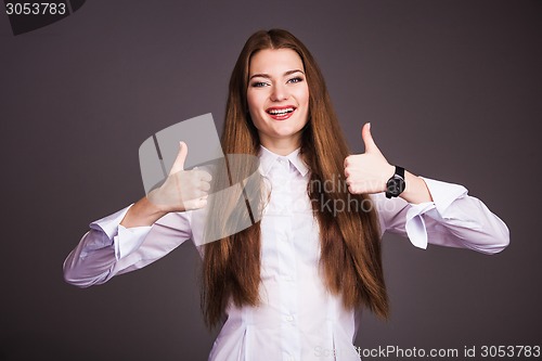 Image of Woman shows thumb up