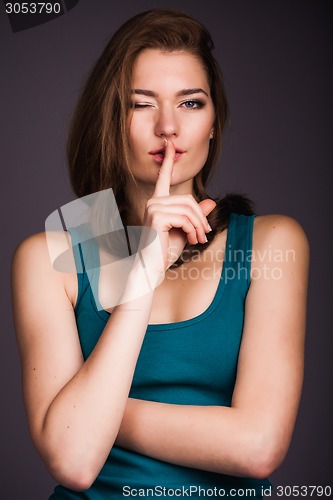 Image of Woman making hush gesture