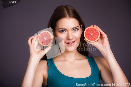 Image of Woman with grapefruit