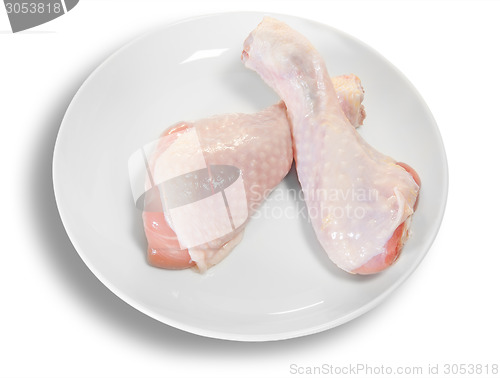 Image of Two Raw Chicken Legs On White Plate
