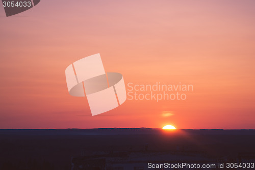 Image of The sun on horizon at sunset landscape 