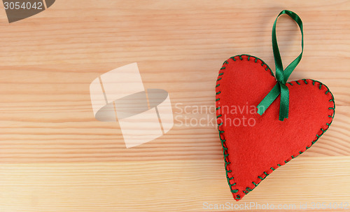 Image of Heart-shaped felt decoration with green ribbon 