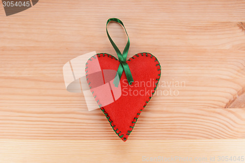 Image of Red felt heart ornament with green ribbon