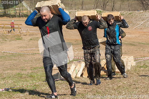 Image of carrying heavy boxes