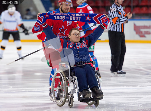 Image of Disabled fan on wheelchair