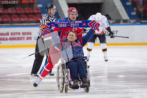 Image of Disabled fan on wheelchair