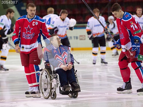 Image of Disabled fan on wheelchair