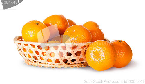 Image of Ripe Sweet Tangerines In Wicker Basket