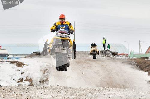 Image of High jump of sportsman on snowmobile