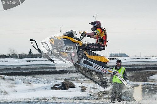 Image of Snowmobile rider on sport track