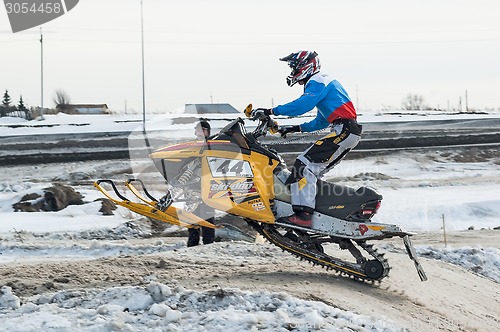 Image of Snowmobile rider on sport track