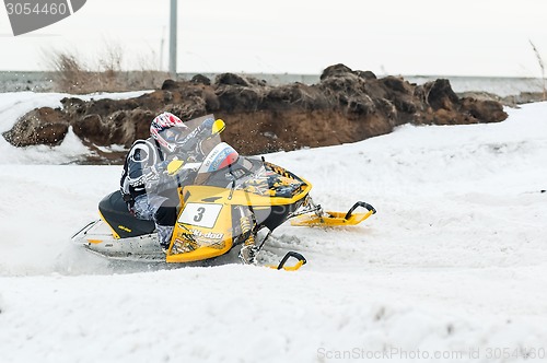 Image of Snowmobile moves on bend of sport track