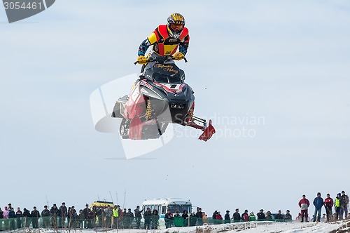 Image of High jump of sportsman on snowmobile