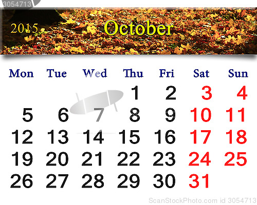 Image of calendar for October of 2015 with yellow leaves