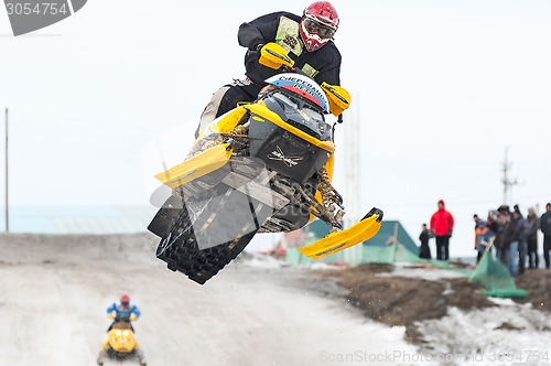 Image of High jump of sportsman on snowmobile