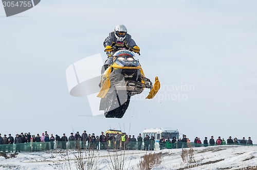 Image of High jump of sportsman on snowmobile