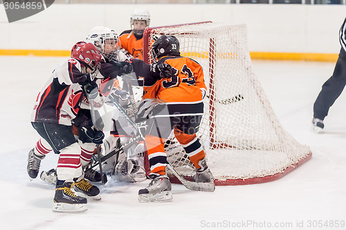 Image of Game between children ice-hockey teams