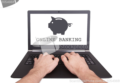 Image of Man working on laptop, online banking