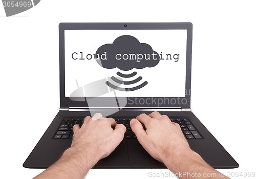 Image of Man working on laptop, cloud computing