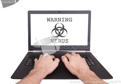 Image of Man working on laptop, computer infected