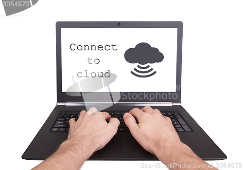 Image of Man working on laptop, cloud computing