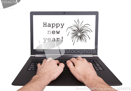 Image of Man working on laptop, happy new year