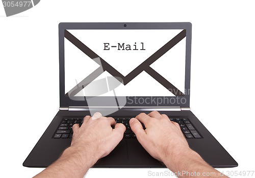 Image of Man working on laptop, new message