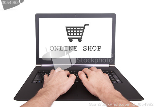 Image of Man working on laptop, online shop