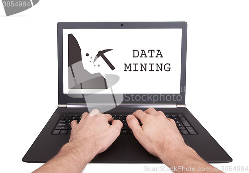 Image of Man working on laptop, data mining