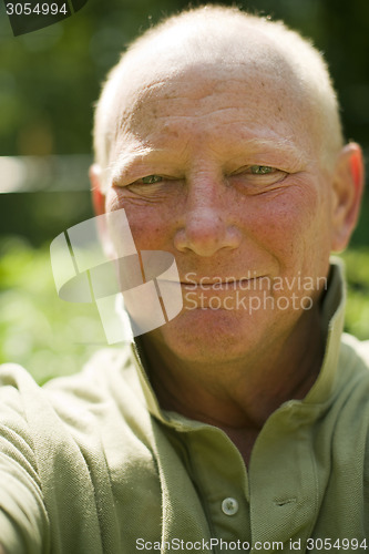 Image of happy smiling middle age senior handsome man